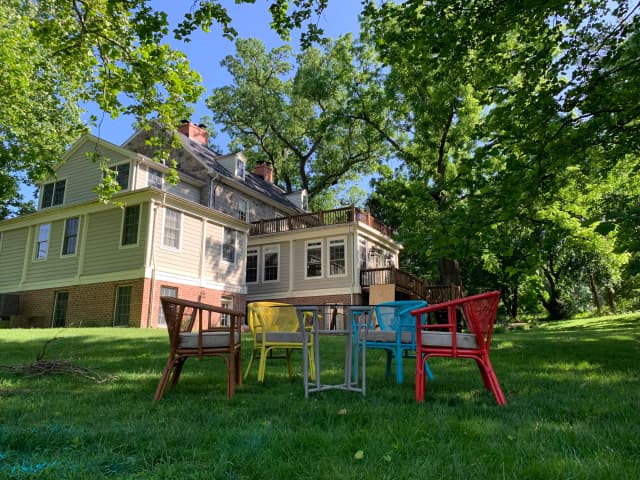 The Wayside Inn outdoor view with colorful outdoor chairs